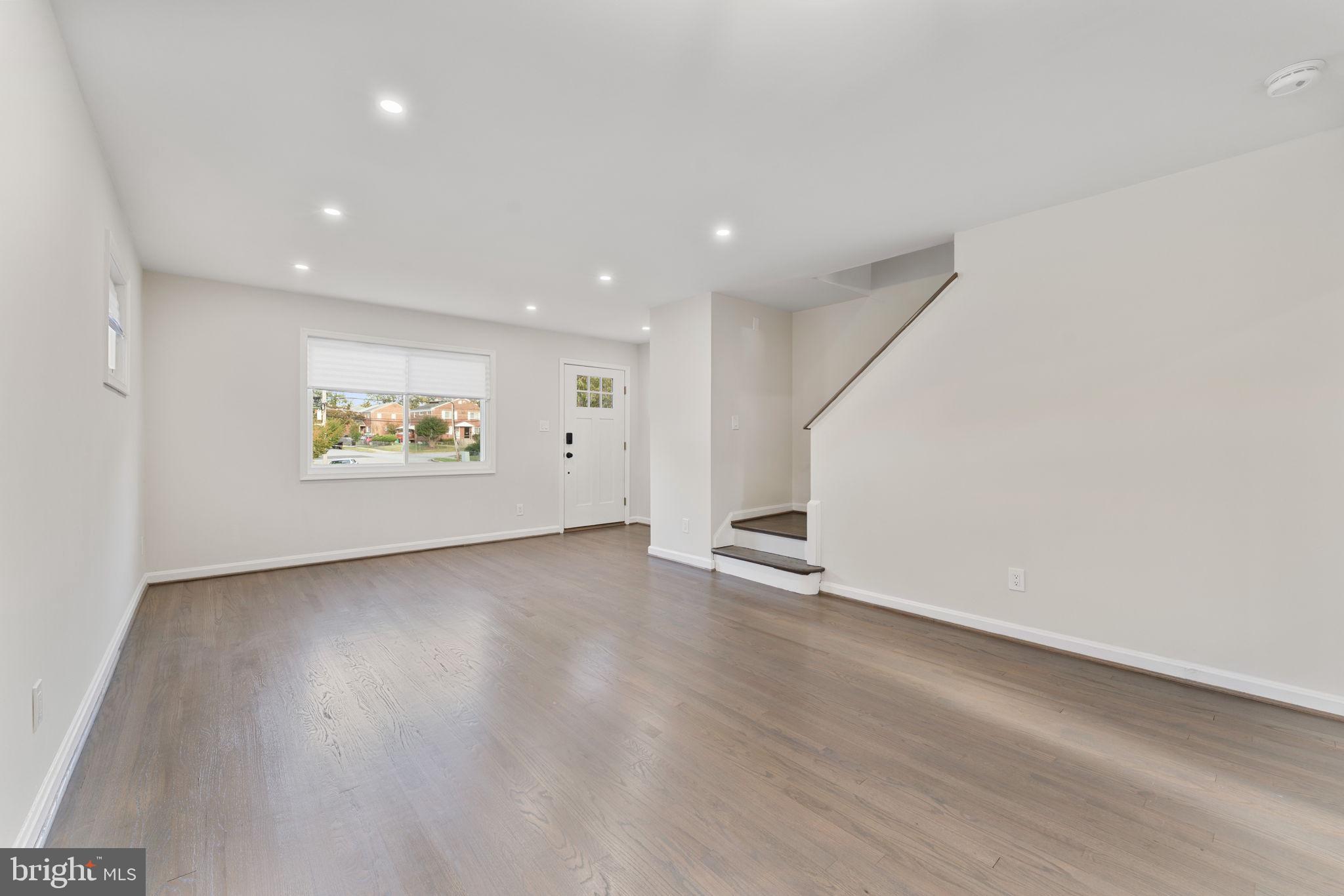 2605 Keith Street Temple Hills, MD 20748 - Photo 5 of 20 an empty room with wooden floor and window