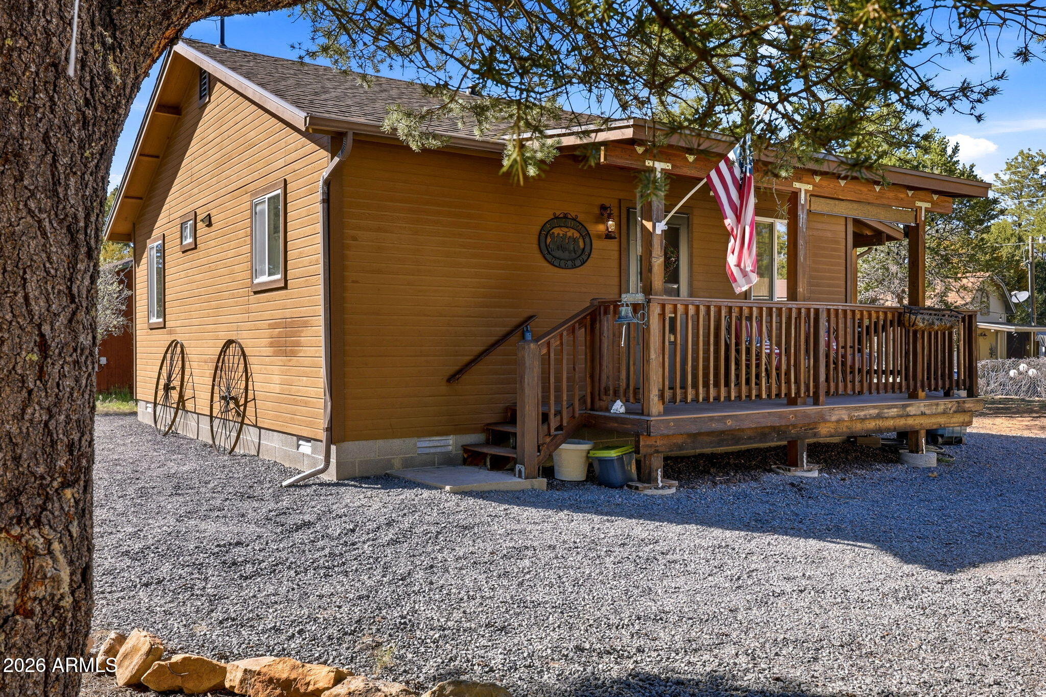 2112 Fishermans Road Overgaard, AZ 85933 - Photo 2 of 18 a view of a house with a yard and a wooden deck
