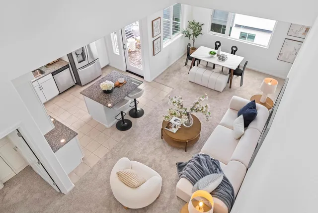 a living room with furniture and white walls