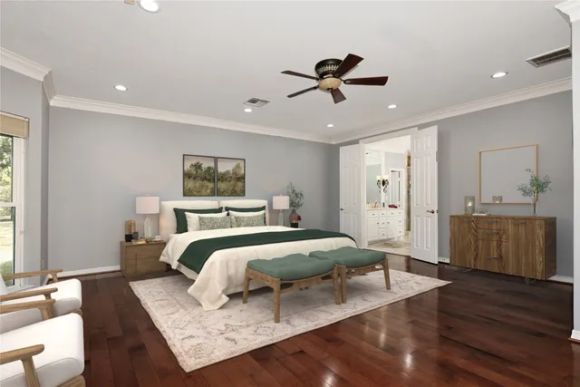 a bedroom with a large bed and a chandelier