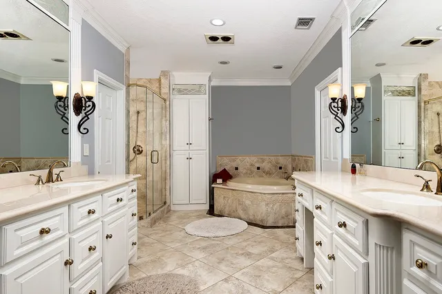 a spacious bathroom with a double vanity sink mirror double and bathtub