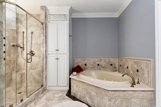 a bath tub sitting next to a shower