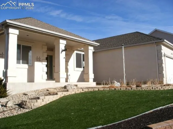 a front view of house with yard