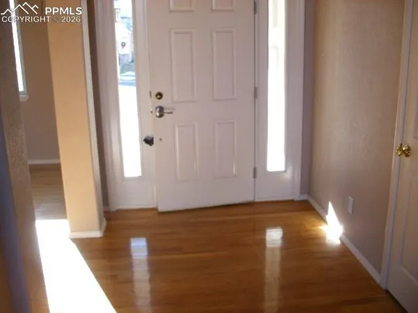 a view of an empty room with windows