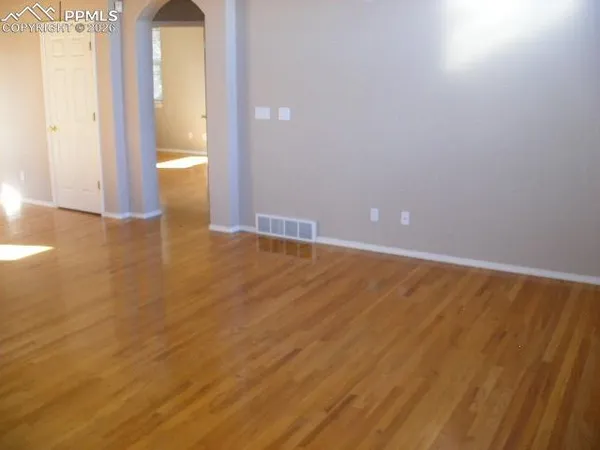 a view of an empty room and window