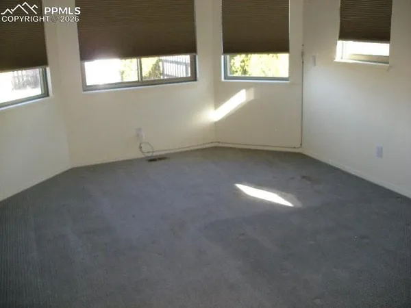 an empty room that has a window