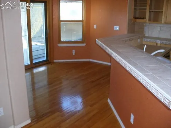a kitchen with a sink and a window