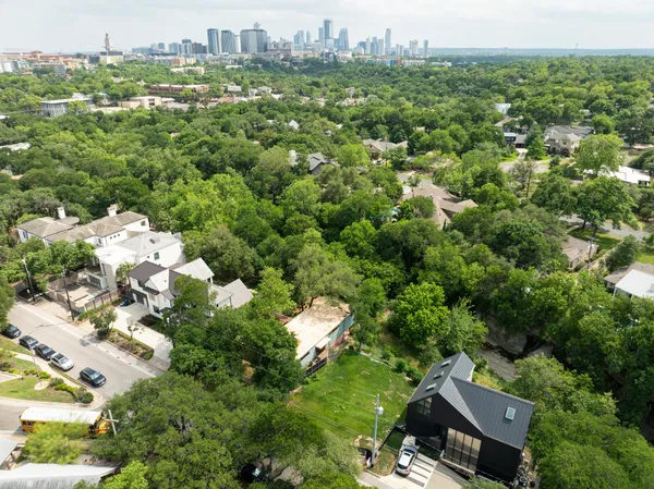 an aerial view of a house with a yard