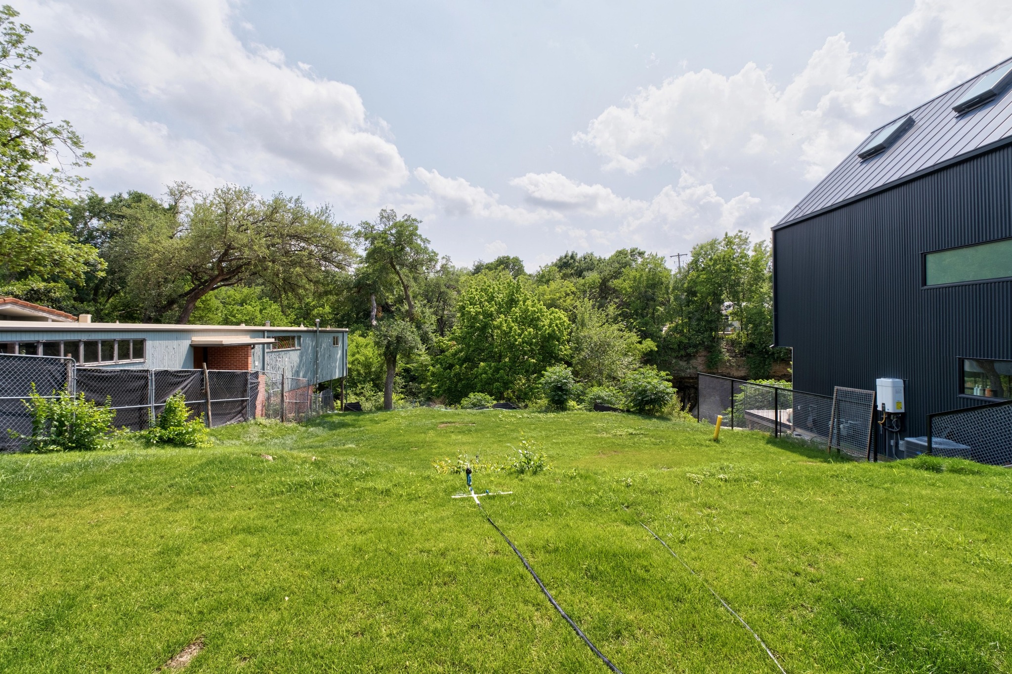 1113 West 31st Street Austin, TX 78705 - Photo 8 of 15 a backyard of a house with table and chairs