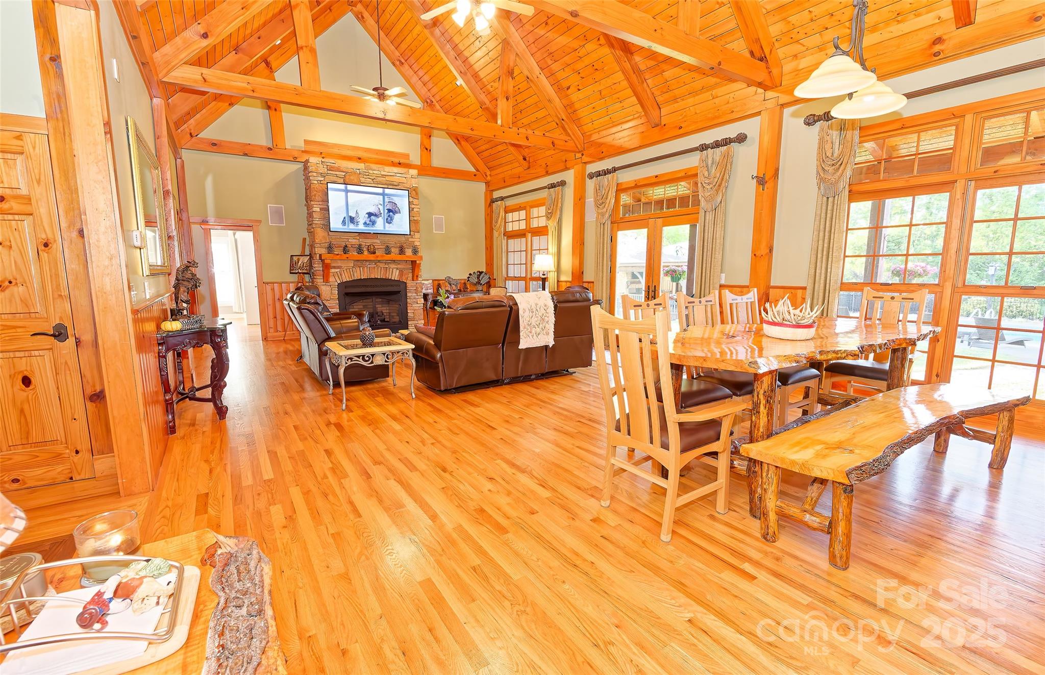 1250 Mountain Creek Road Rutherfordton, NC 28139 - Photo 12 of 48 a living room filled with furniture and a chandelier