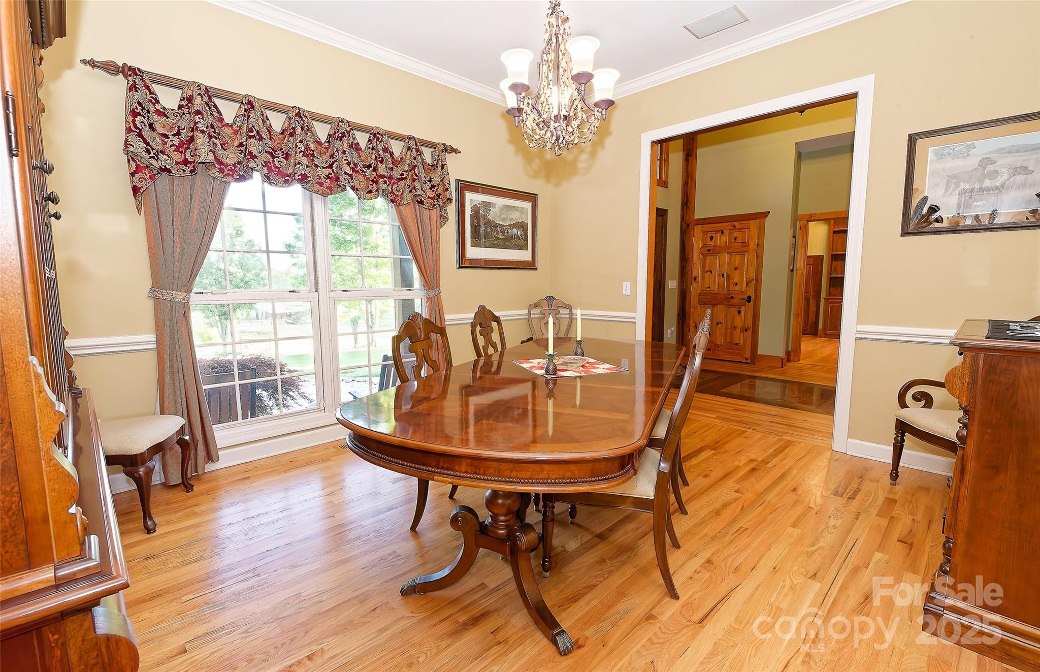 1250 Mountain Creek Road Rutherfordton, NC 28139 - Photo 15 of 48 a view of a dining room with furniture window and wooden floor