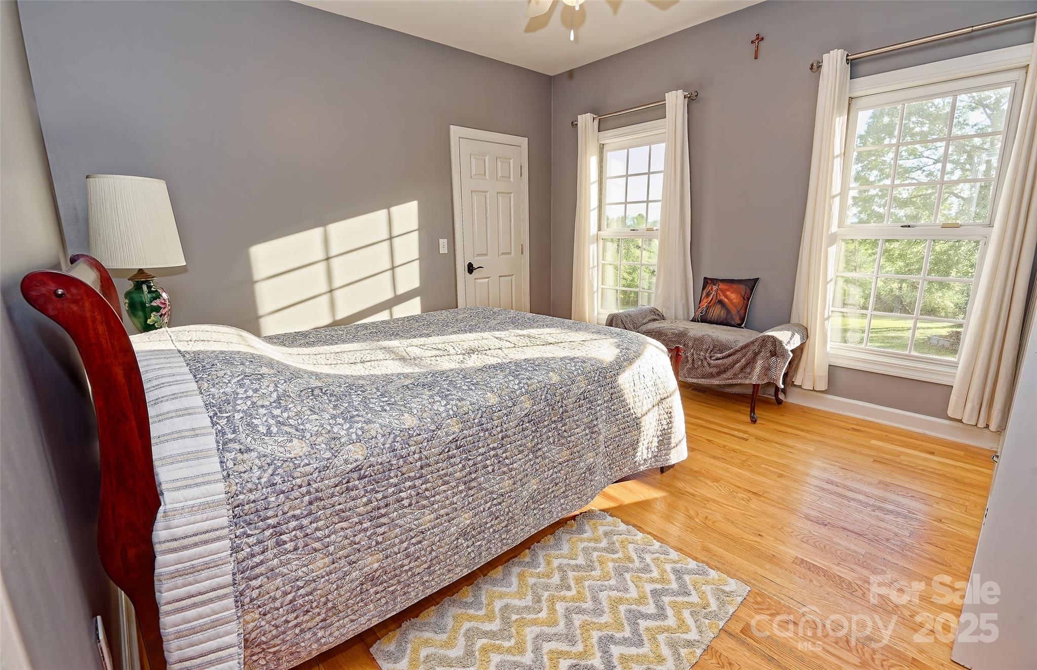 1250 Mountain Creek Road Rutherfordton, NC 28139 - Photo 25 of 48 a bed sitting in a bedroom next to a window