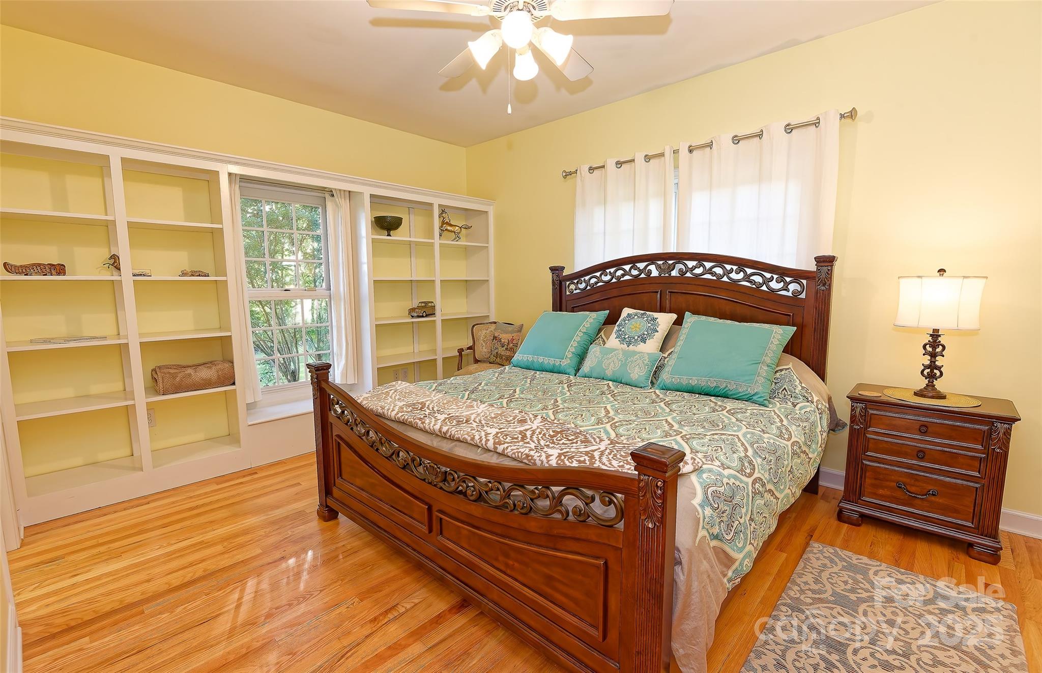 1250 Mountain Creek Road Rutherfordton, NC 28139 - Photo 26 of 48 a bedroom with a bed and wooden floor