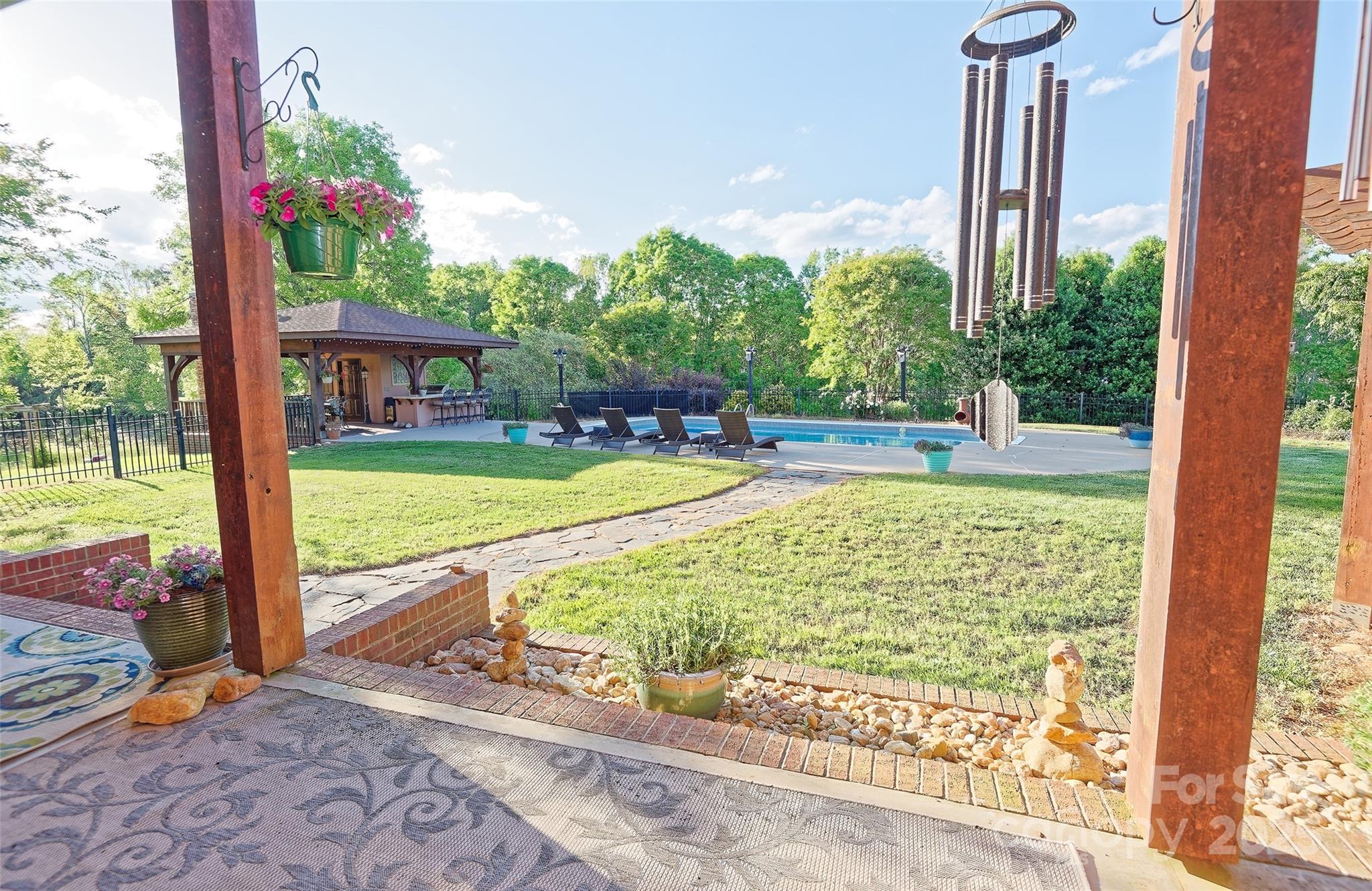 1250 Mountain Creek Road Rutherfordton, NC 28139 - Photo 33 of 48 a view of a swimming pool with a patio