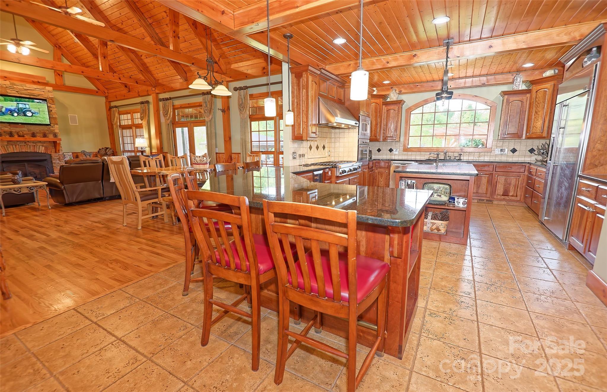 1250 Mountain Creek Road Rutherfordton, NC 28139 - Photo 10 of 48 a dining room with furniture and a floor to ceiling window