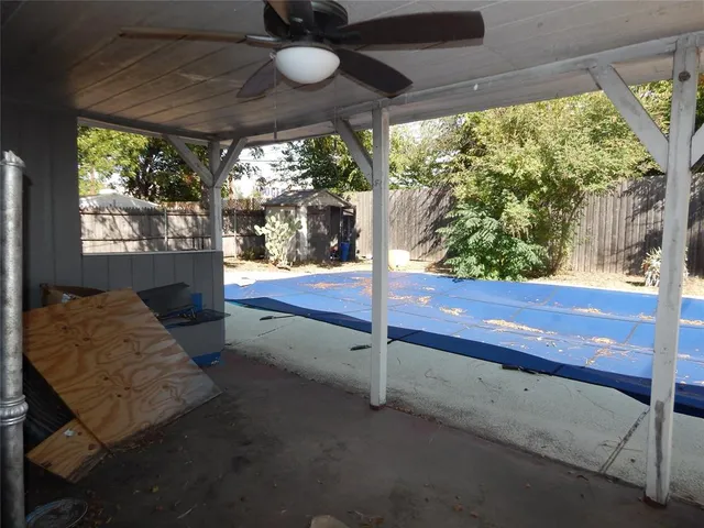 a bedroom with a bed and large window