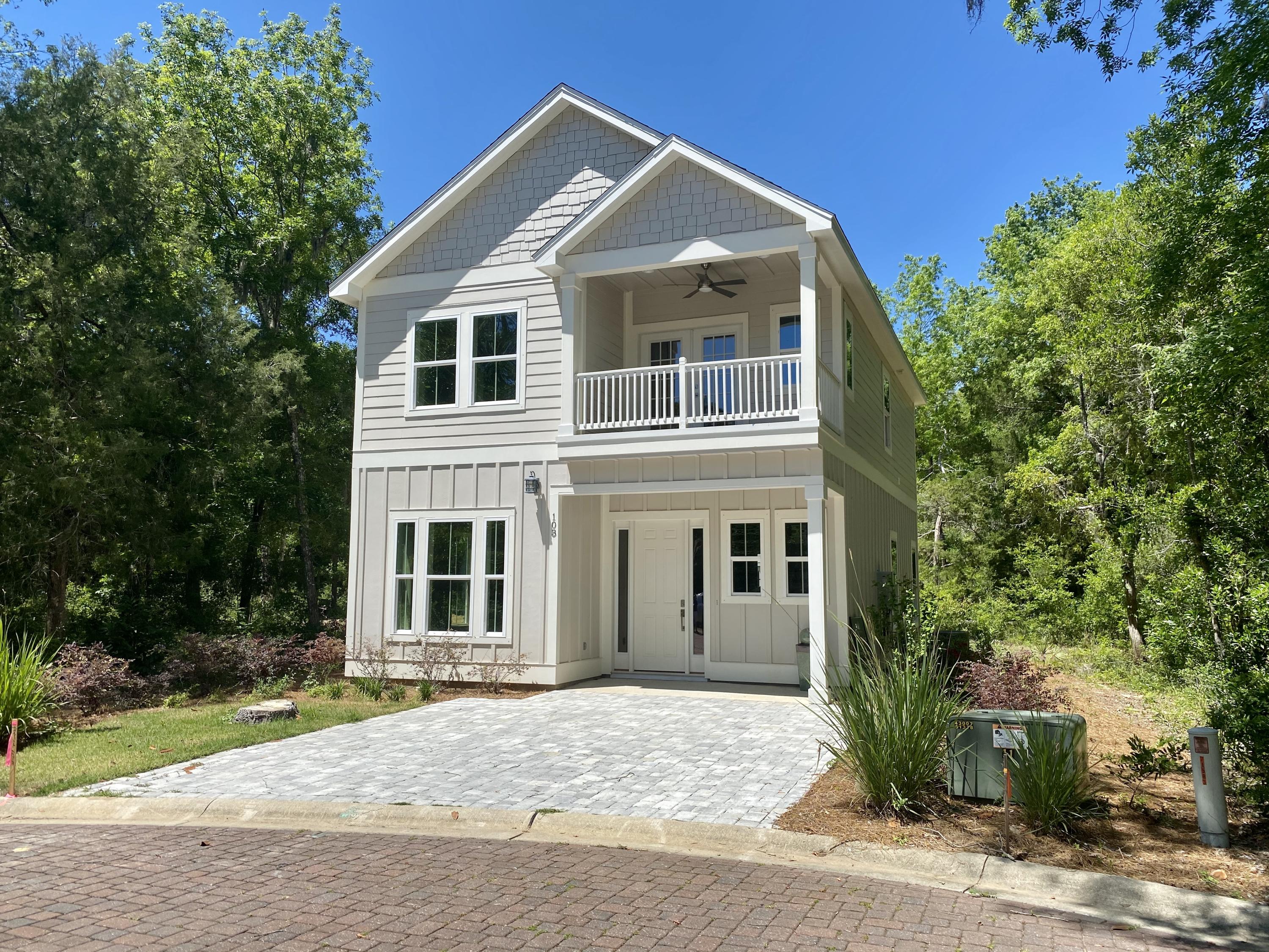 103 Rearden Way Santa Rosa Beach, FL 32459 - Photo 1 of 31 a front view of a house with a yard