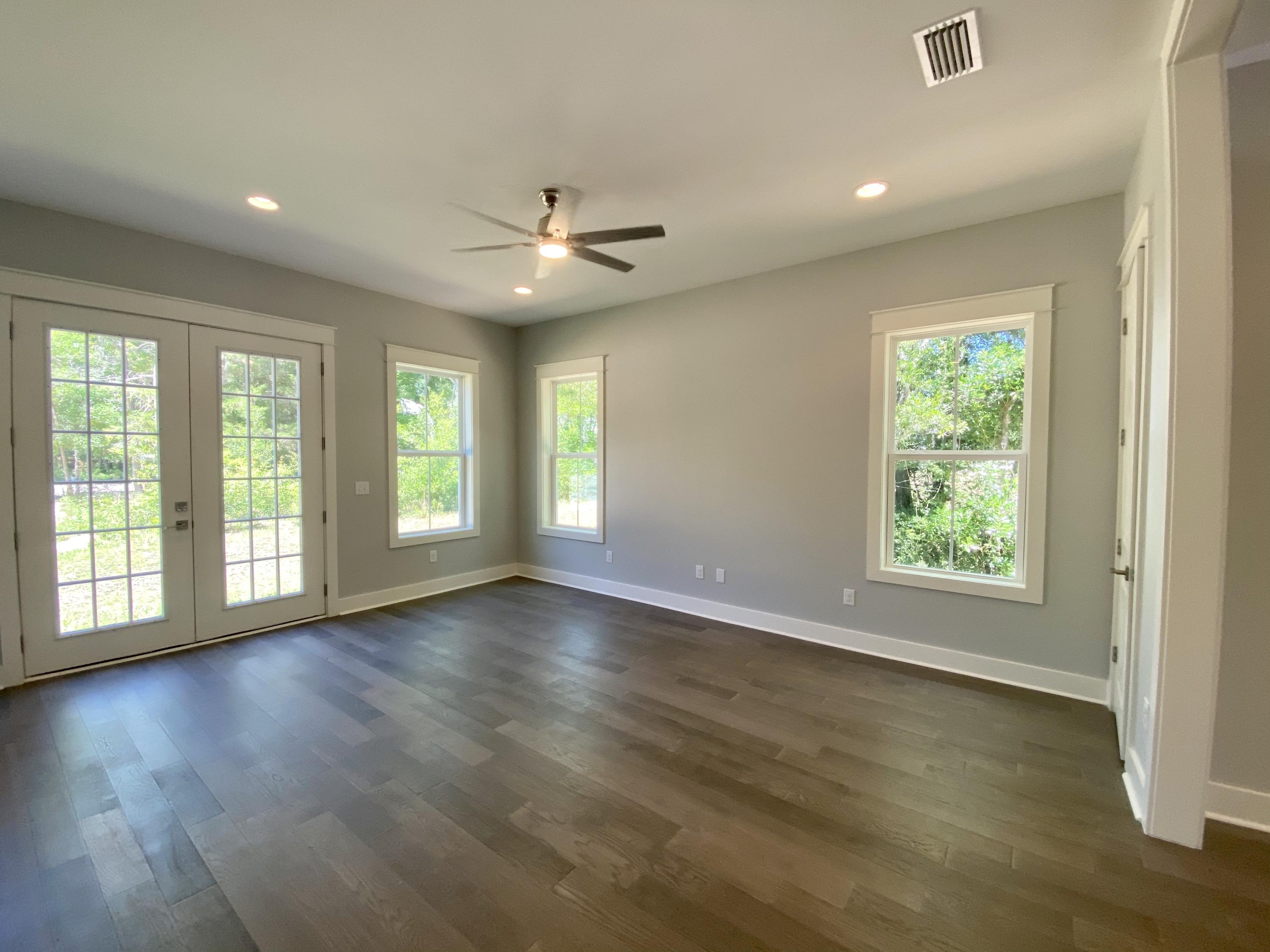 103 Rearden Way Santa Rosa Beach, FL 32459 - Photo 11 of 31 a view of an empty room with wooden floor and a window