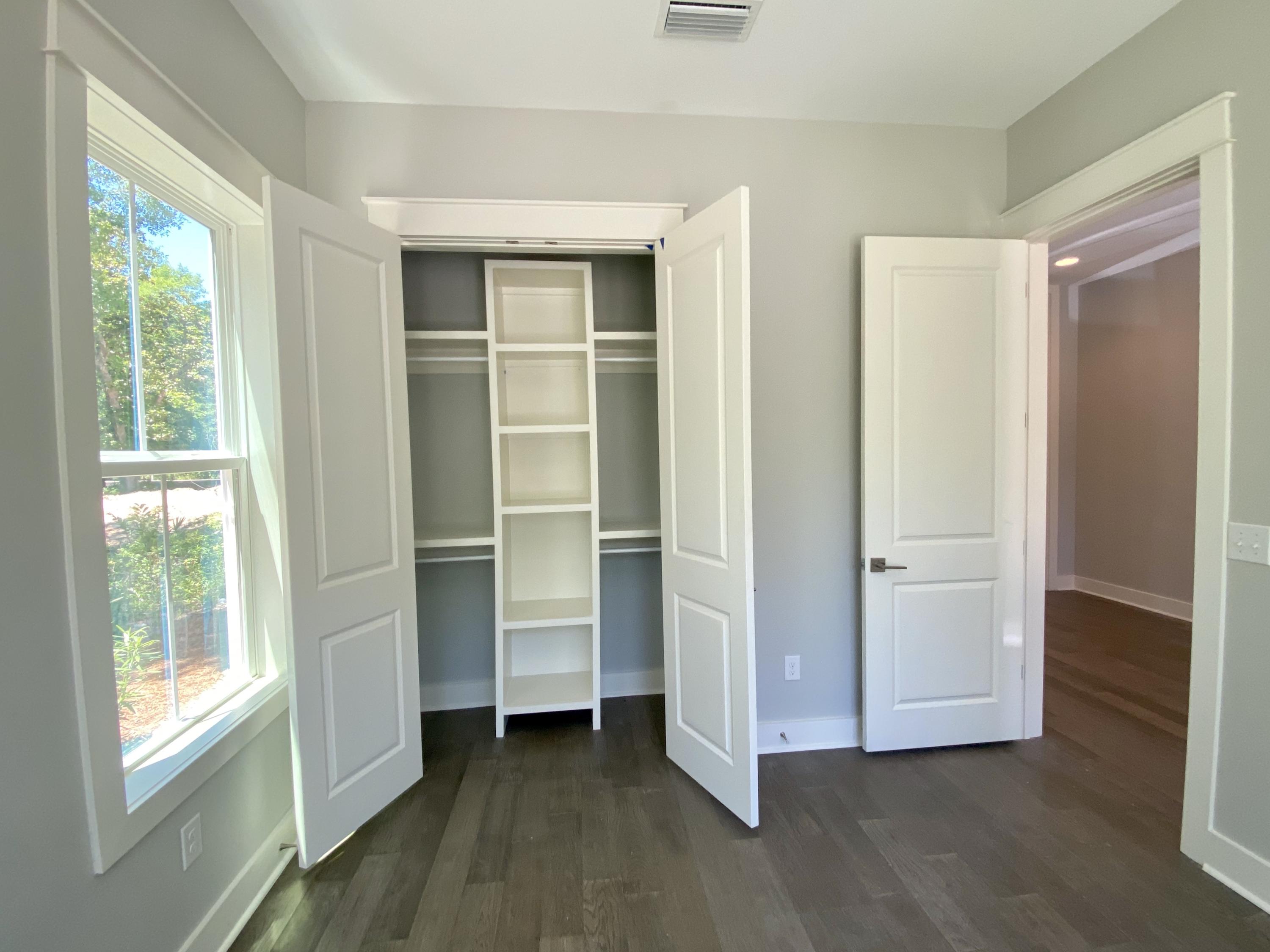 103 Rearden Way Santa Rosa Beach, FL 32459 - Photo 14 of 31 a view of an empty room with wooden floor and a window