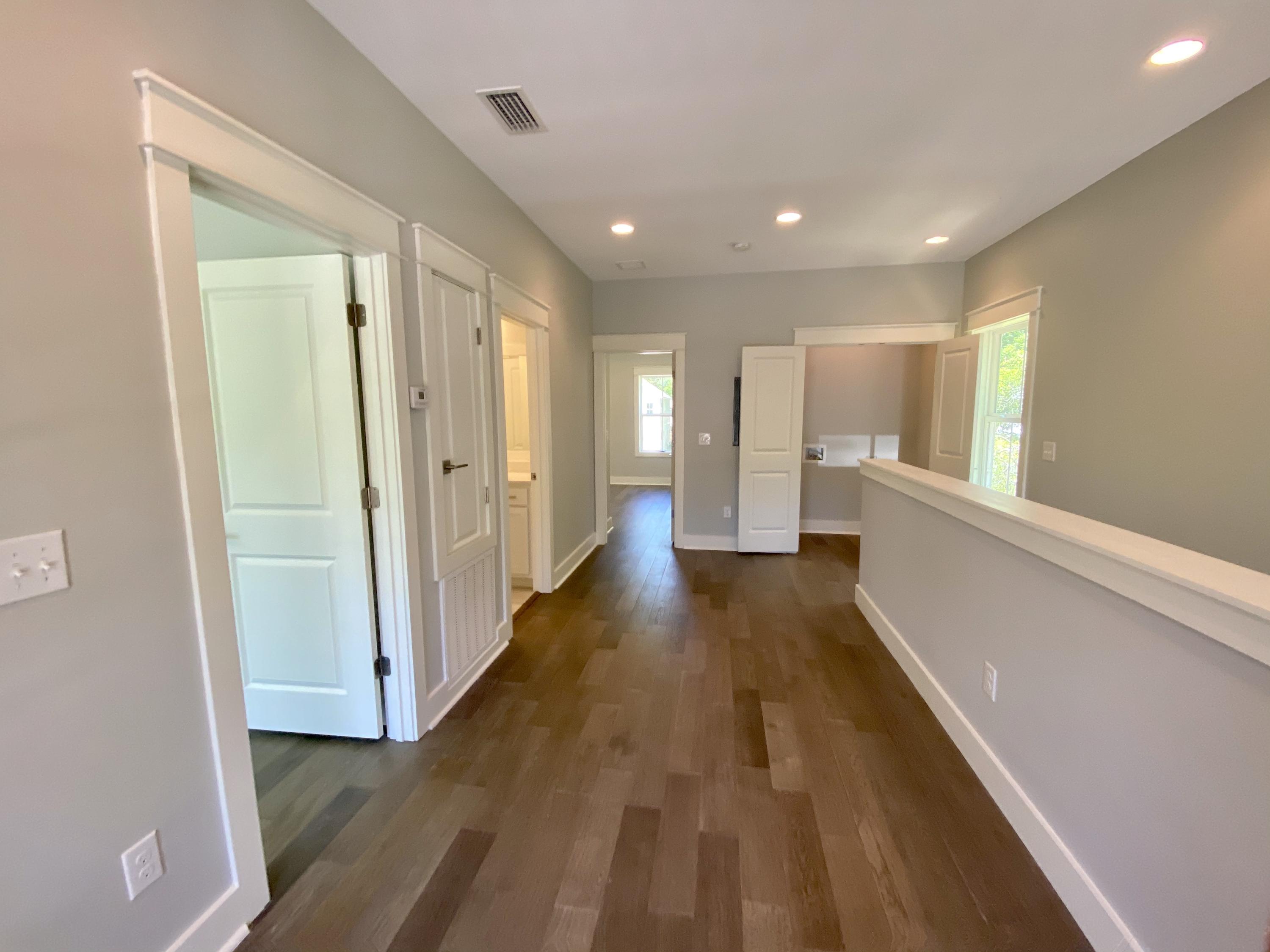 103 Rearden Way Santa Rosa Beach, FL 32459 - Photo 22 of 31 a view of a big room with wooden floor and windows