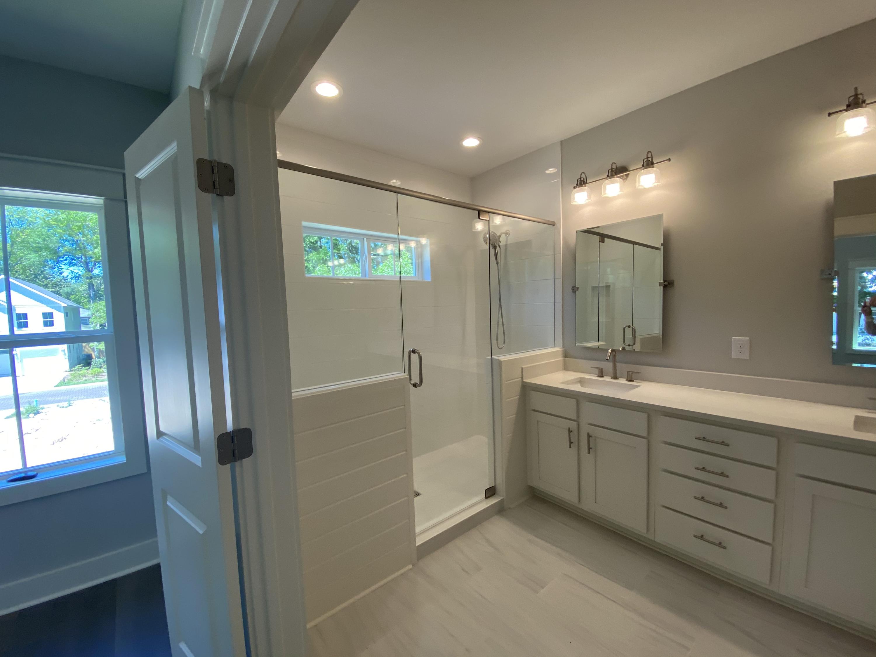 103 Rearden Way Santa Rosa Beach, FL 32459 - Photo 27 of 31 a bathroom with double vanity and a shower
