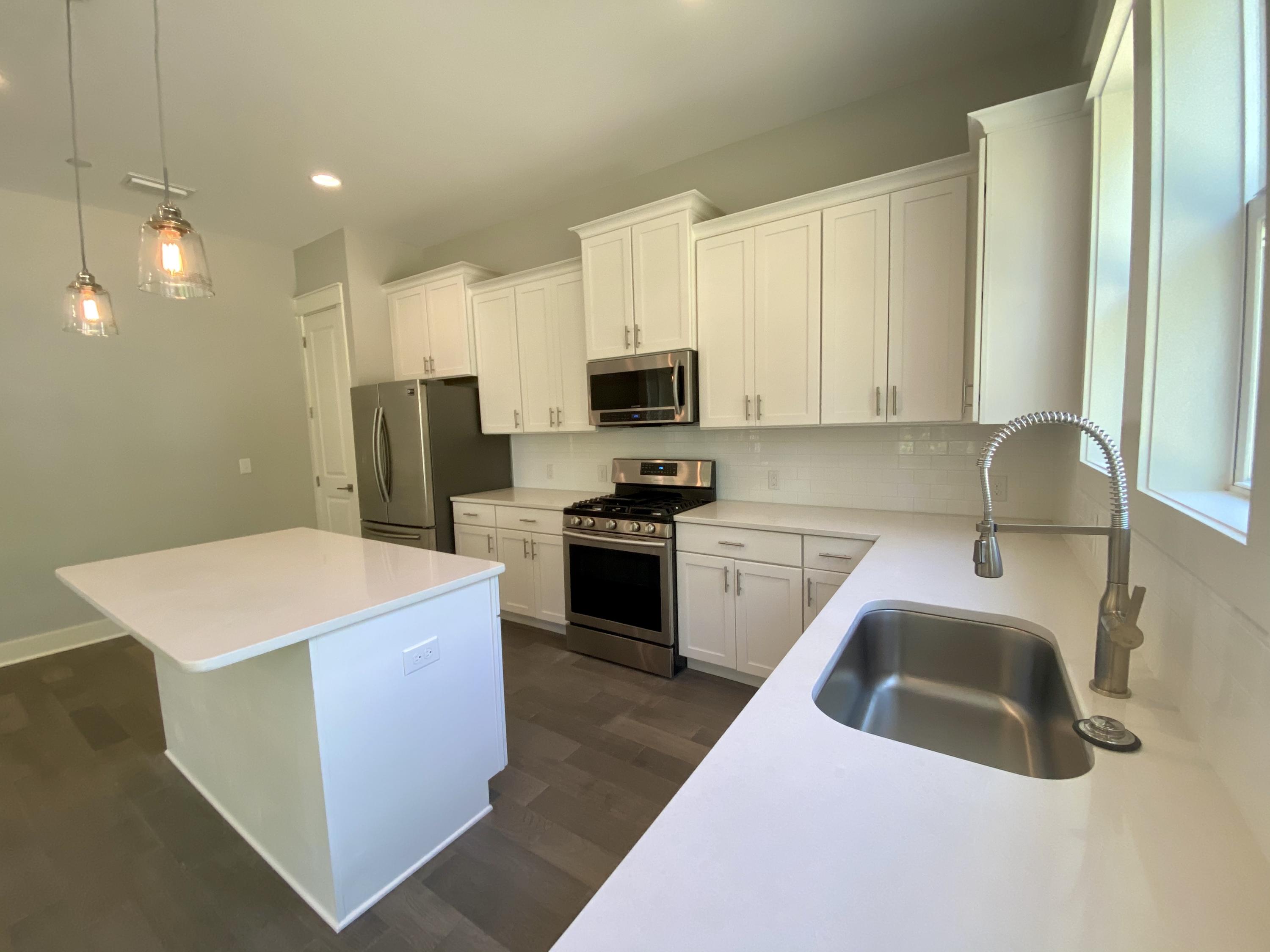 103 Rearden Way Santa Rosa Beach, FL 32459 - Photo 6 of 31 a kitchen that has a sink and a stove top oven