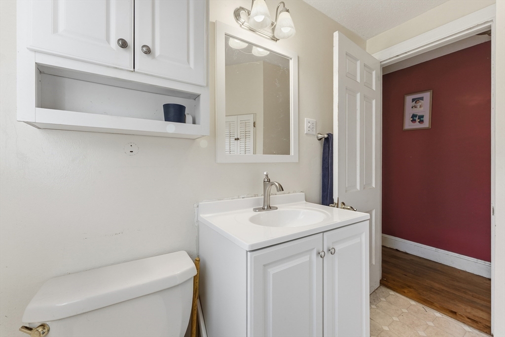 289 Morgan Street South Hadley, MA 01075 - Photo 18 of 42 a bathroom with a toilet sink and mirror
