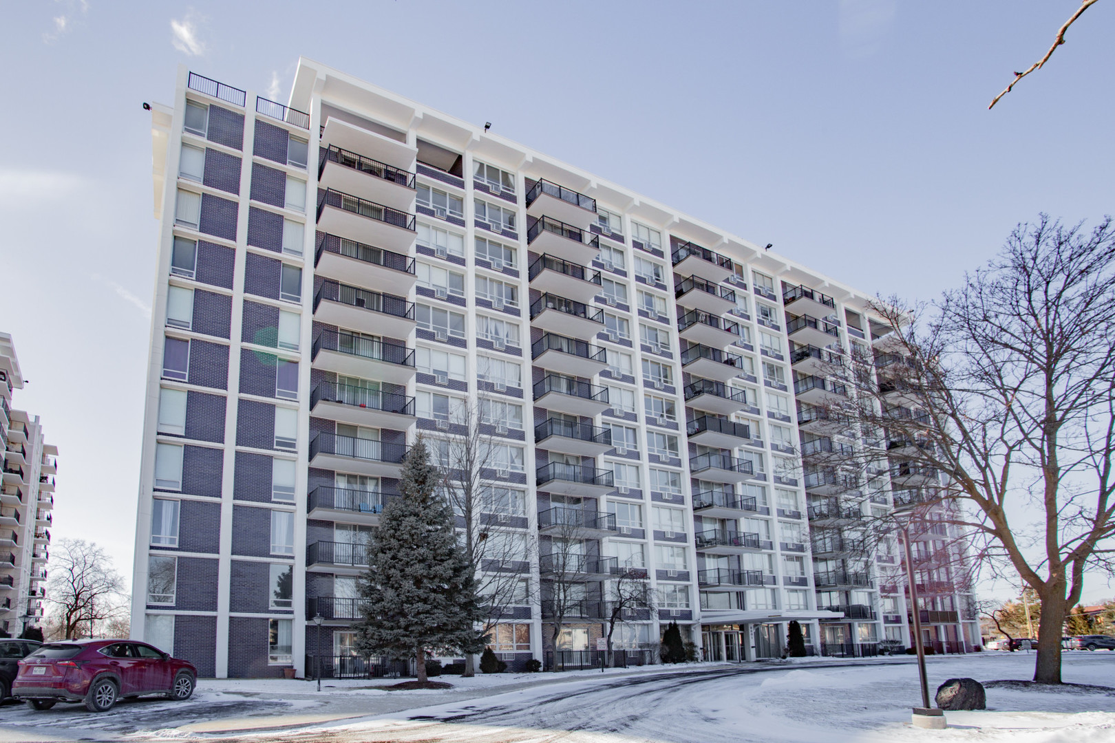 a view of a building with a yard