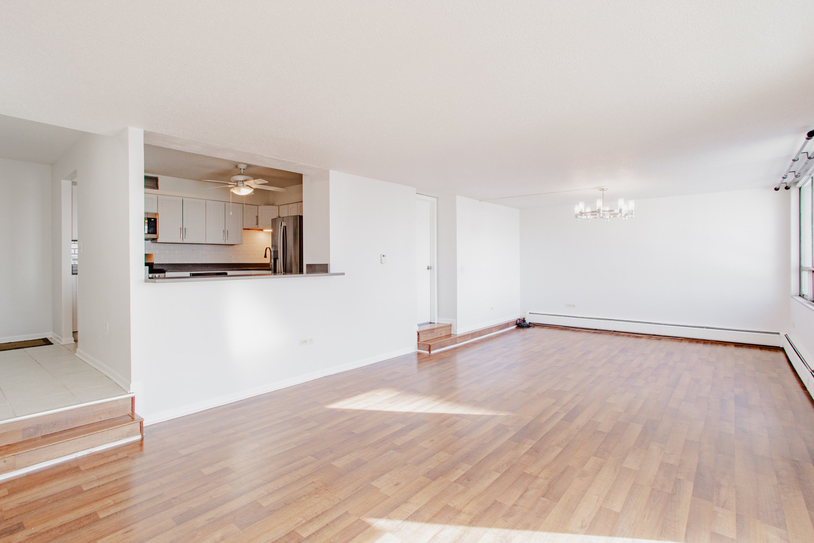 8801 West Golf Road, Unit 6B Niles, IL 60714 - Photo 2 of 13 a view of a room with wooden floor and cabinet