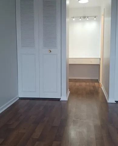 a view of a storage & utility room with multiple dryer