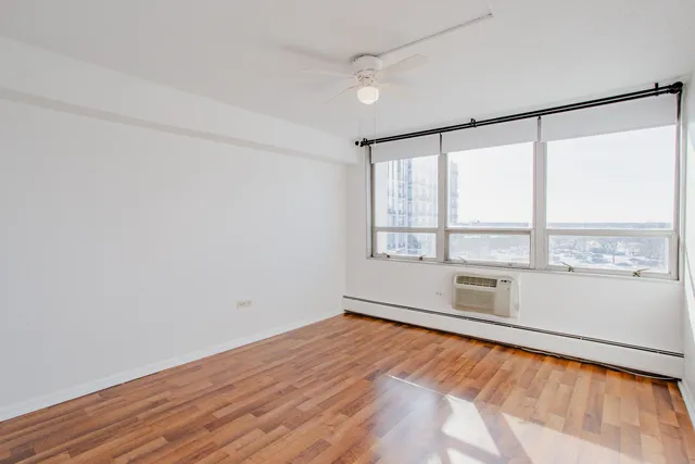 a view of an empty room with a window