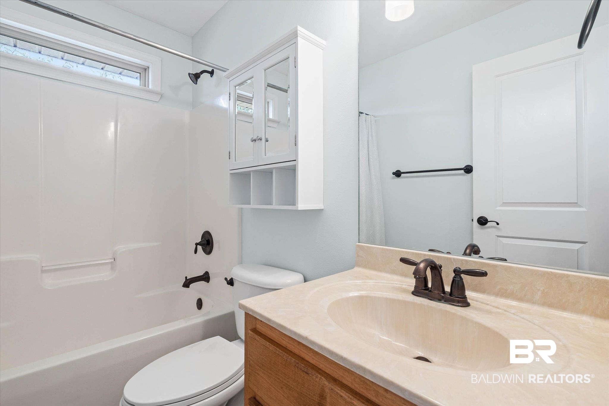 704 Edinburgh Avenue Foley, AL 36535 - Photo 23 of 32 Full bathroom with vanity and shower / bath combination with curtain