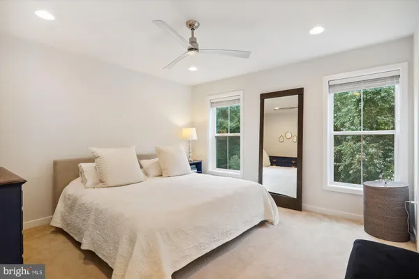 a bathroom with a sink toilet and a mirror
