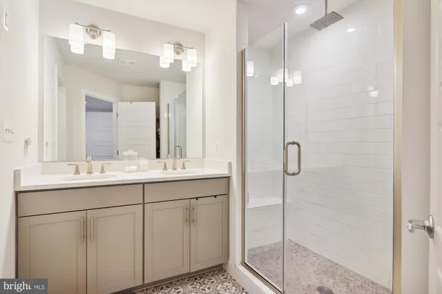 a spacious bedroom with a large bed and a large window