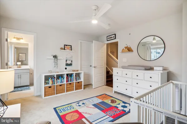 a bathroom with a double vanity sink a mirror and a shower