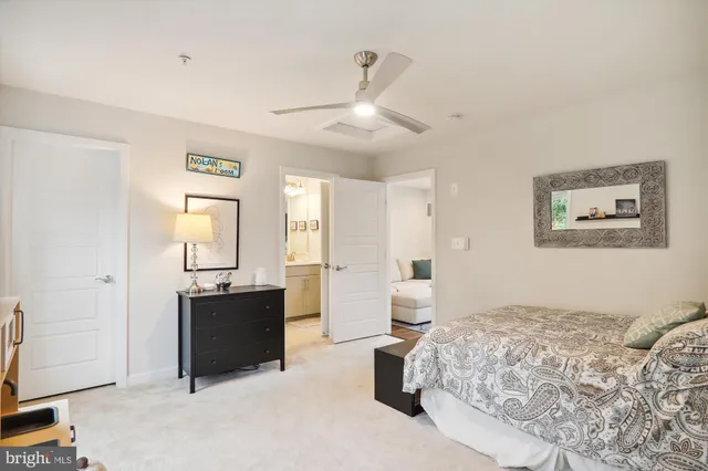 a spacious bedroom with a bed and a walk in closet