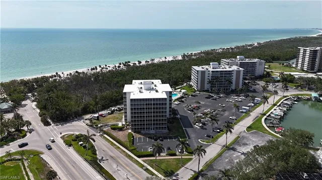 a living room with furniture wooden floor and a window