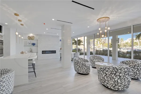 a view of kitchen with furniture and wooden floor