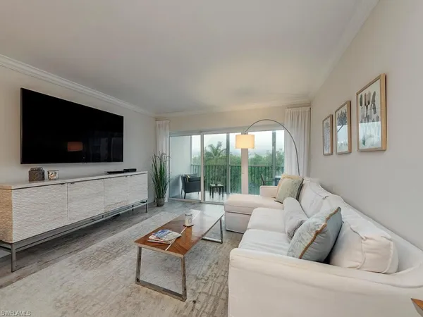 a kitchen with stainless steel appliances granite countertop a stove a refrigerator and a microwave