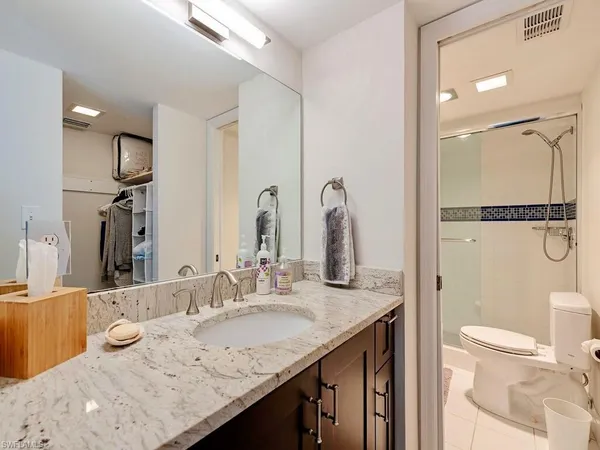 a bedroom with two beds and a table