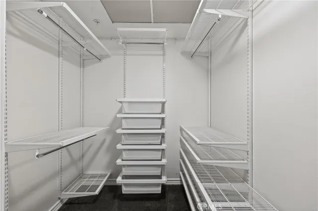 a view of staircase with white walls and stairs