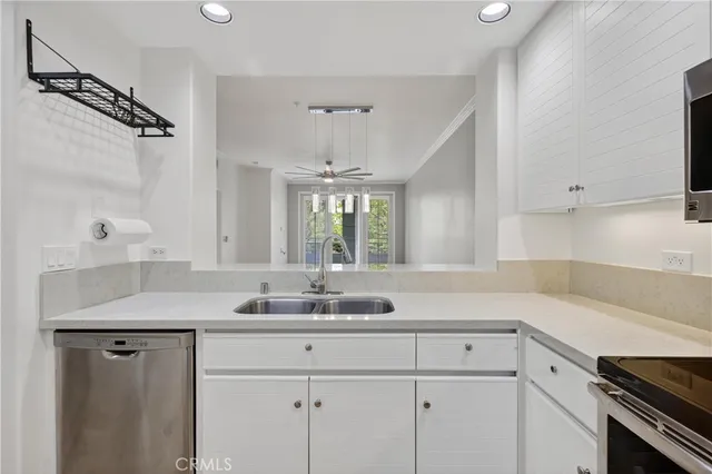a kitchen with a sink and cabinets