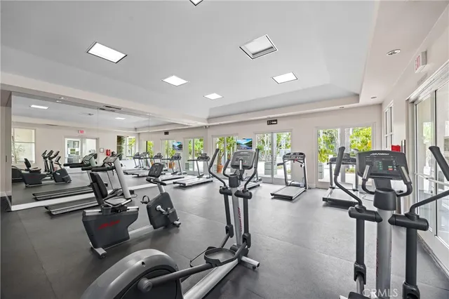 a living room with fireplace furniture and a large window