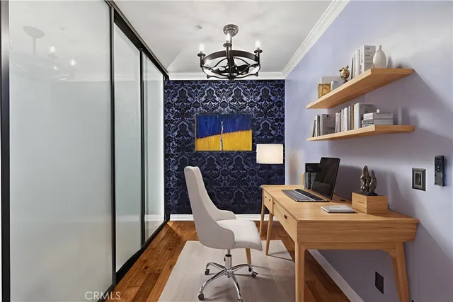 a work room with furniture and chandelier