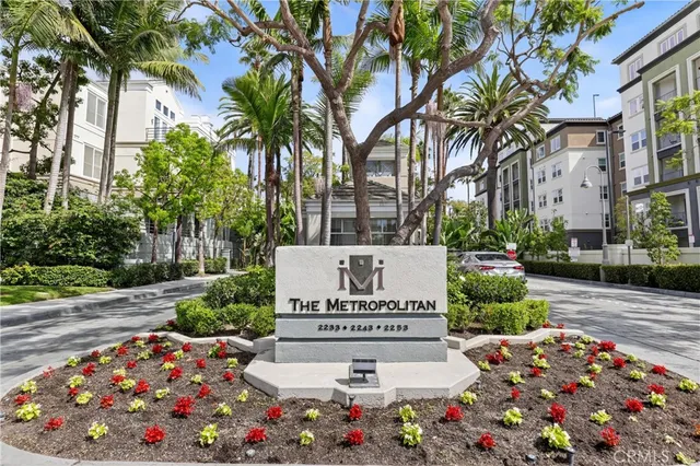 a sign that is in front of flowers