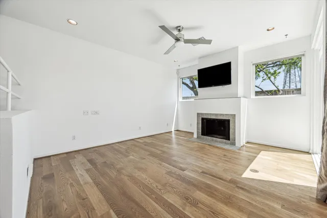 a view of a livingroom with an empty space and a fireplace