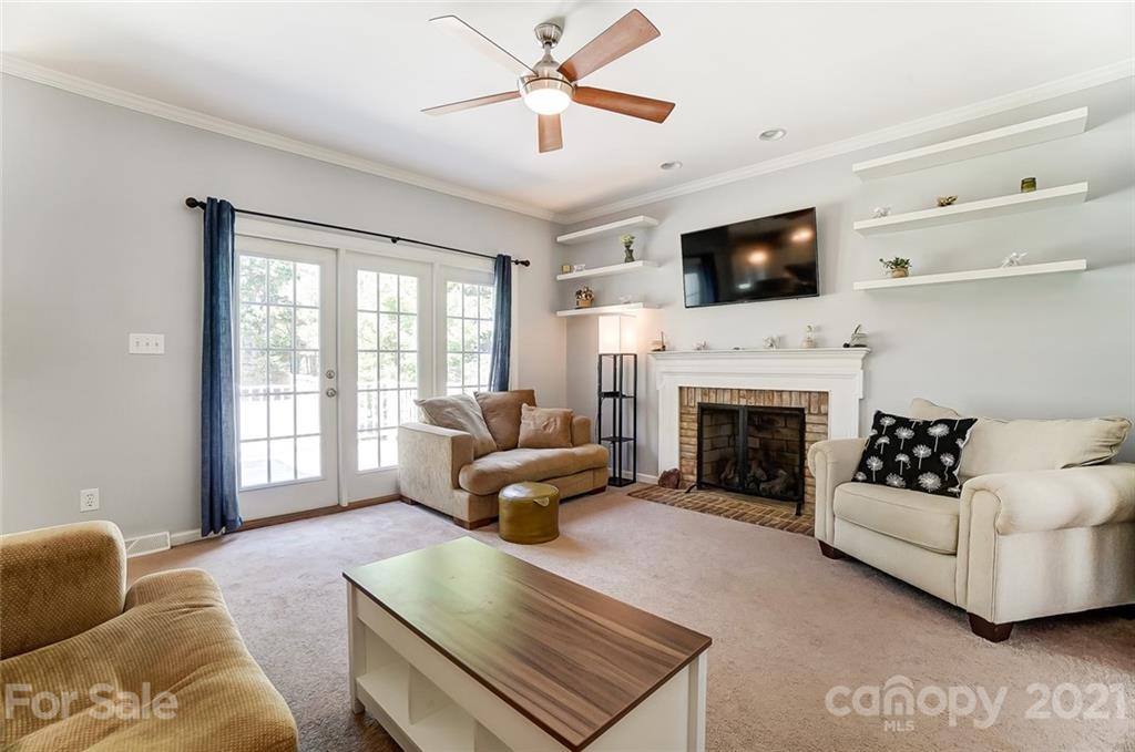 1999 Steeplechase Drive Rock Hill, SC 29732 - Photo 12 of 34 a living room with furniture fireplace and flat screen tv
