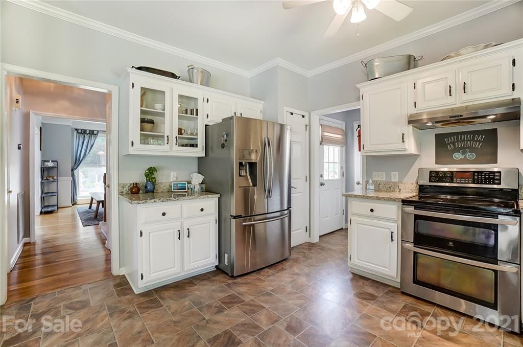 1999 Steeplechase Drive Rock Hill, SC 29732 - Photo 16 of 34 a kitchen with granite countertop a refrigerator stove and oven