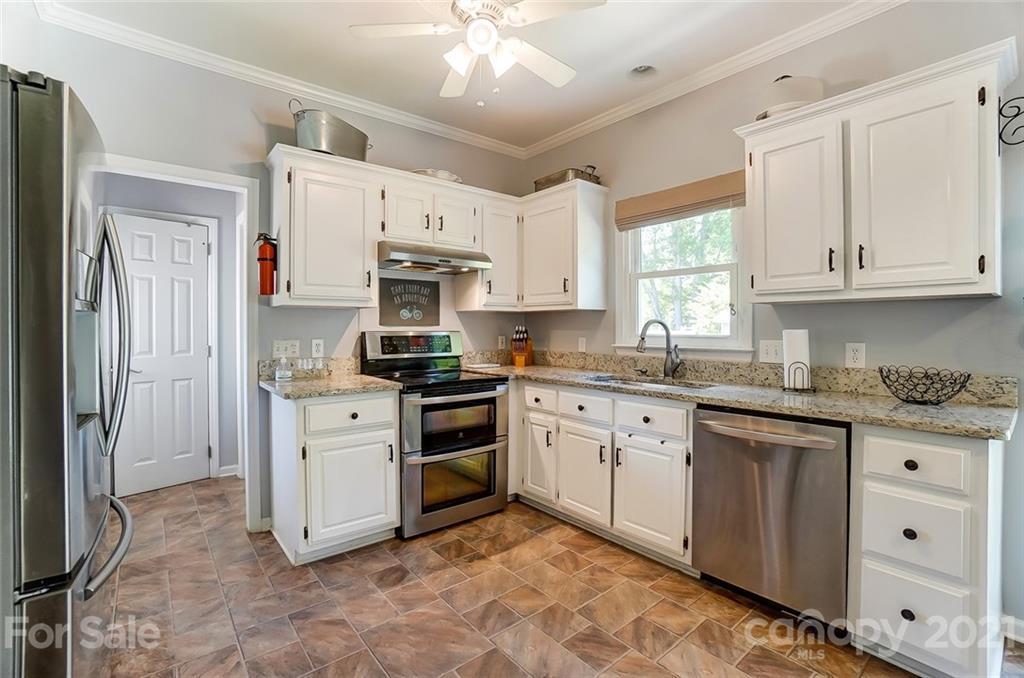 1999 Steeplechase Drive Rock Hill, SC 29732 - Photo 17 of 34 a kitchen with granite countertop a sink stainless steel appliances and window