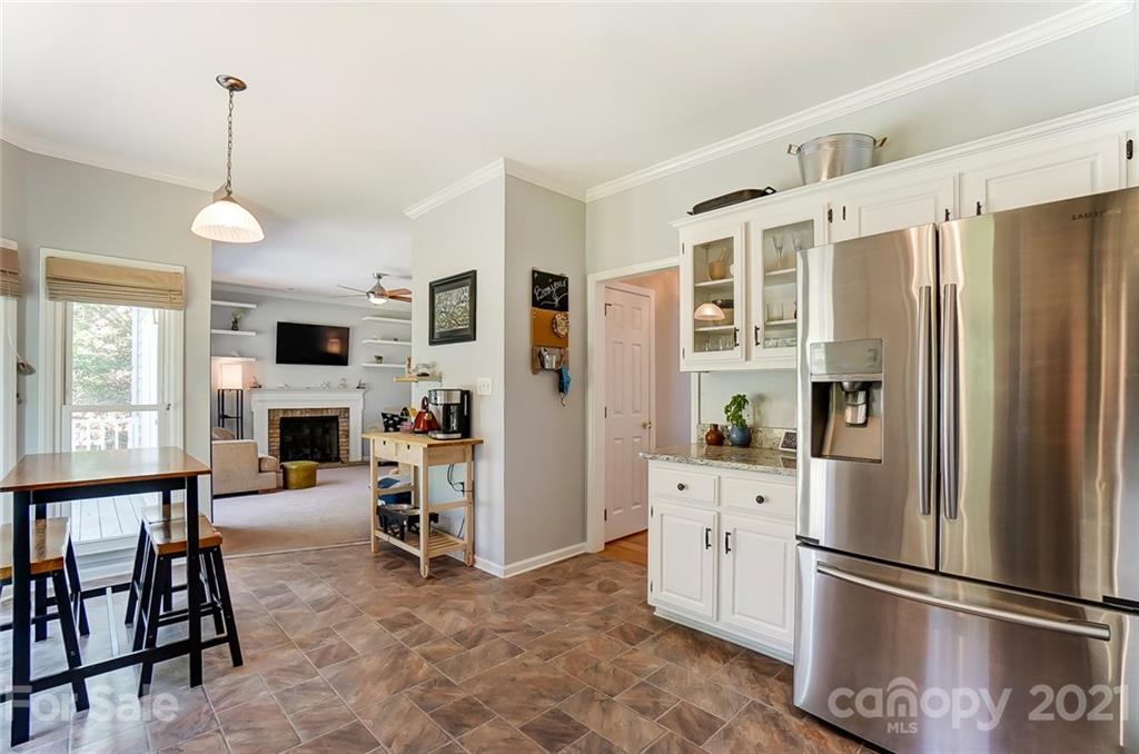 1999 Steeplechase Drive Rock Hill, SC 29732 - Photo 19 of 34 a kitchen with stainless steel appliances granite countertop a refrigerator and a fireplace